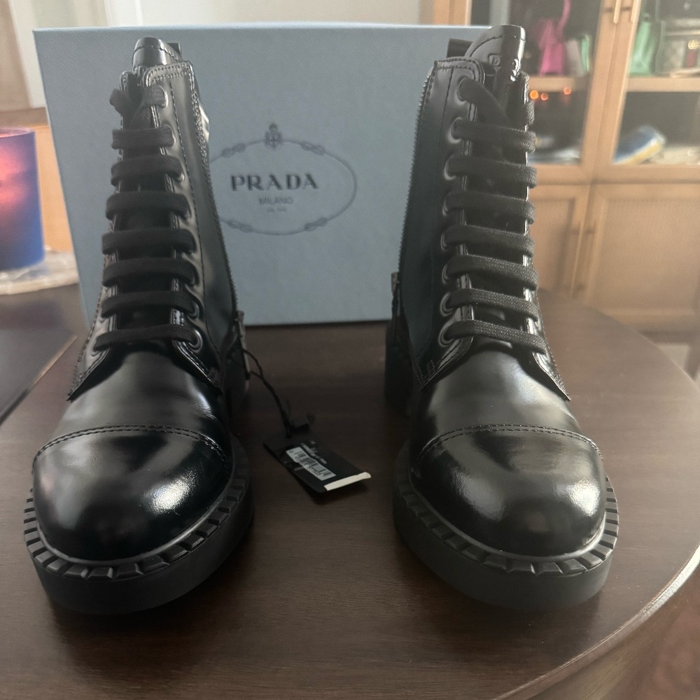 PRADA SPAZZOLATO LEATHER COMBAT BOOTS IN BLACK